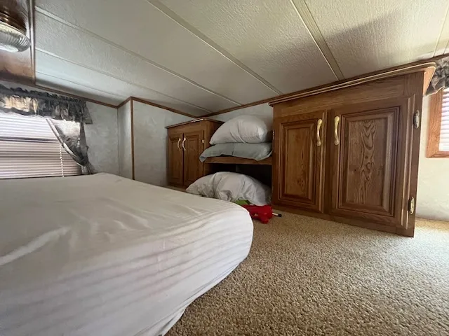 a view of a patio with table and chairs