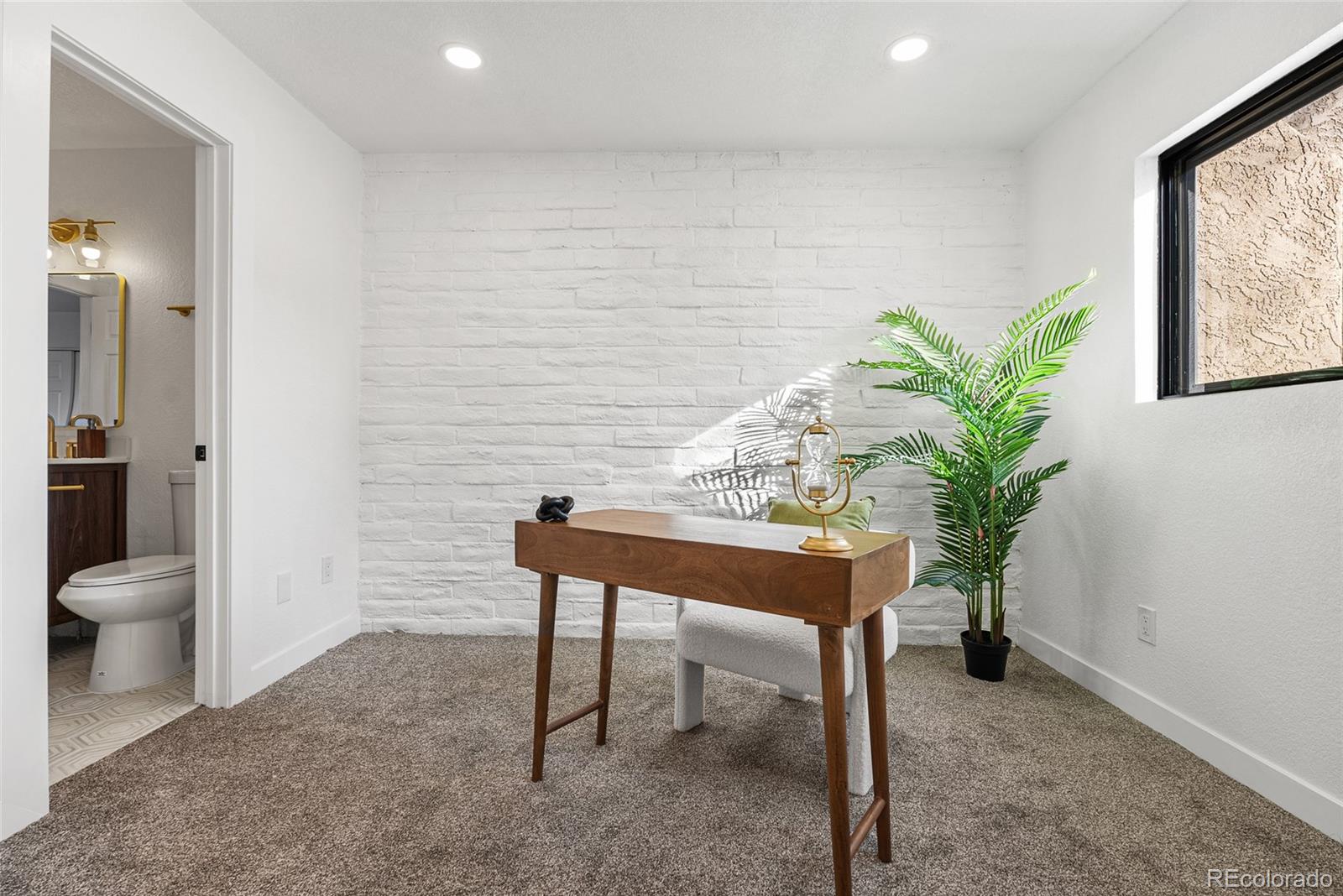 1060 South Parker Road, Unit 35 Denver, CO 80231 - Photo 11 of 25 a view of a room with a potted plant and couches