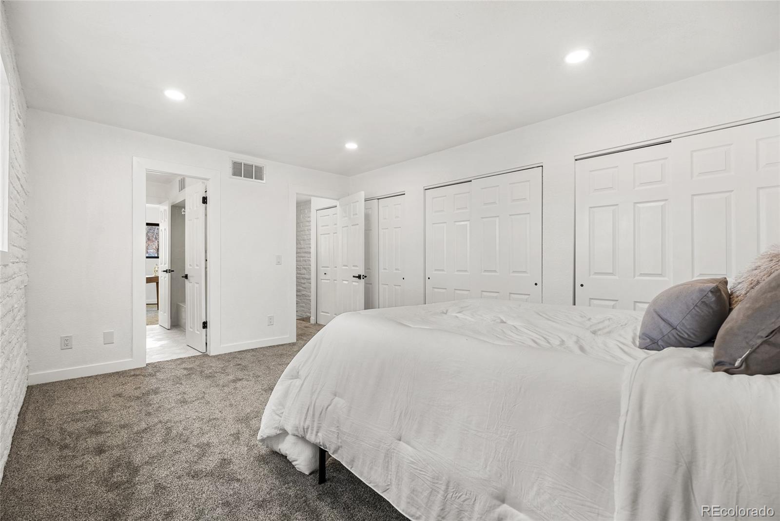 1060 South Parker Road, Unit 35 Denver, CO 80231 - Photo 17 of 25 a bedroom with a bed and closet