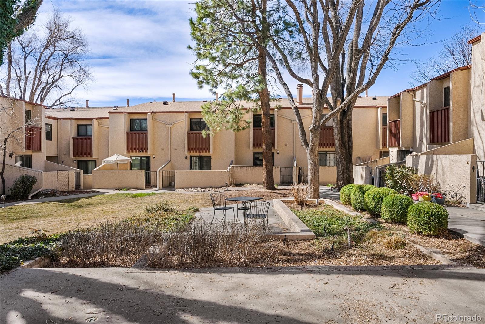 1060 South Parker Road, Unit 35 Denver, CO 80231 - Photo 21 of 25 a front view of a house with garden