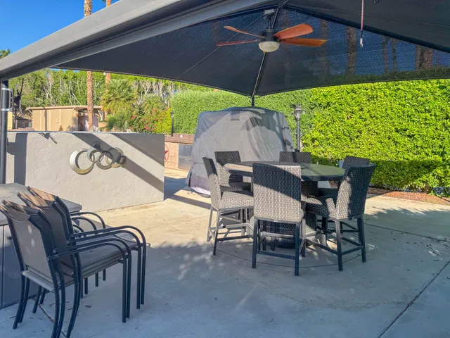 a view of a back yard from a balcony