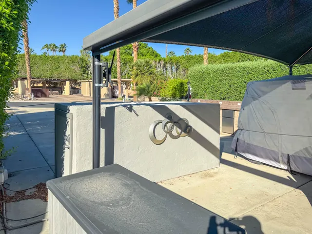a patio with a yard table and chairs