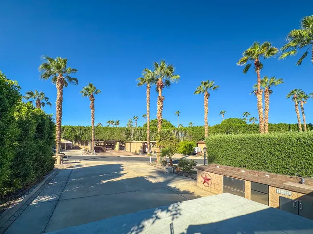 a view of swimming pool from a balcony