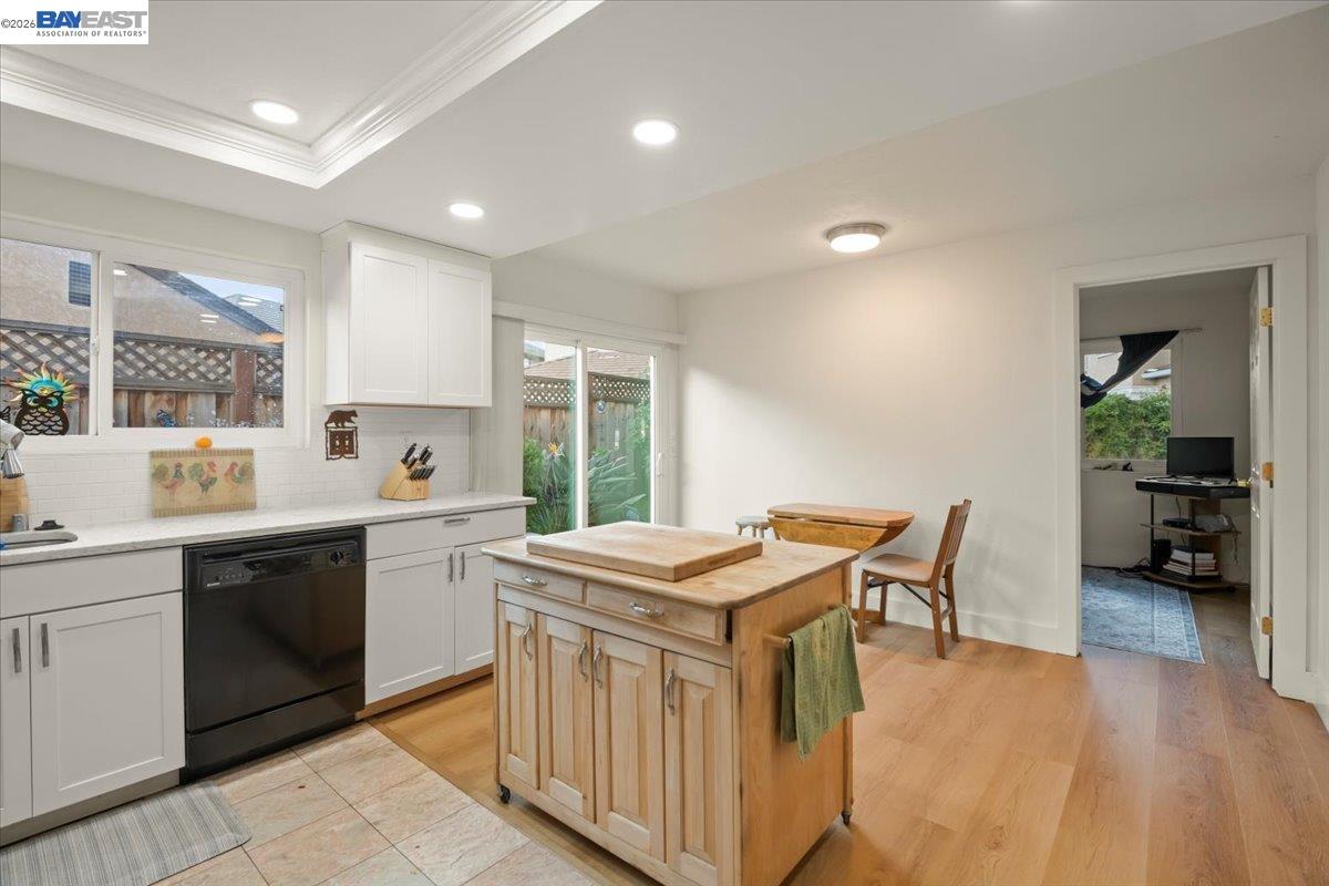 298 Edwin Way Hayward, CA 94544 - Photo 11 of 24 a kitchen that has a sink a table and chairs in it