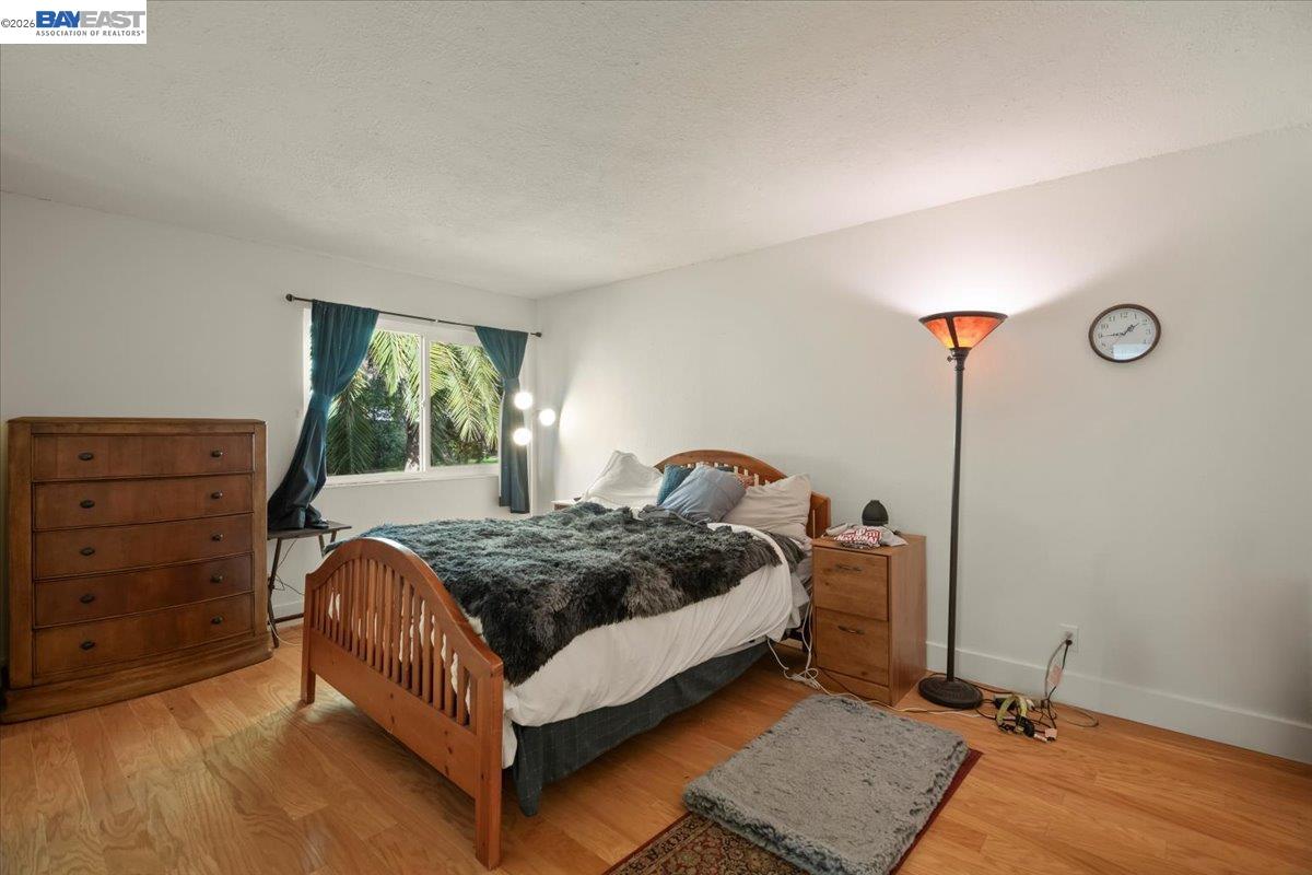 298 Edwin Way Hayward, CA 94544 - Photo 16 of 24 a bed room with a bed and a window