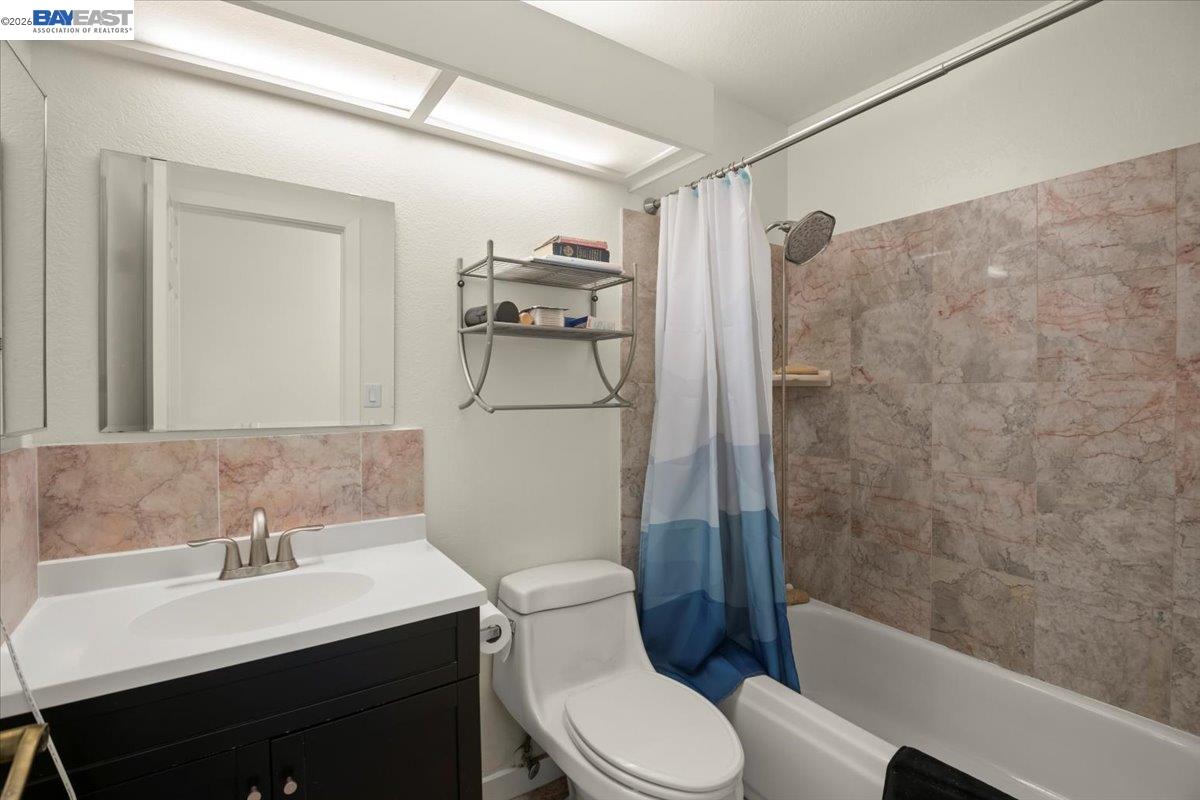 298 Edwin Way Hayward, CA 94544 - Photo 17 of 24 a bathroom with a sink toilet and shower