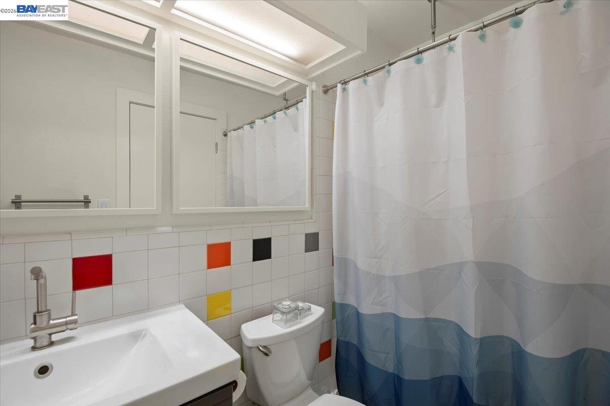 298 Edwin Way Hayward, CA 94544 - Photo 20 of 24 a bathroom with a sink toilet vanity and shower