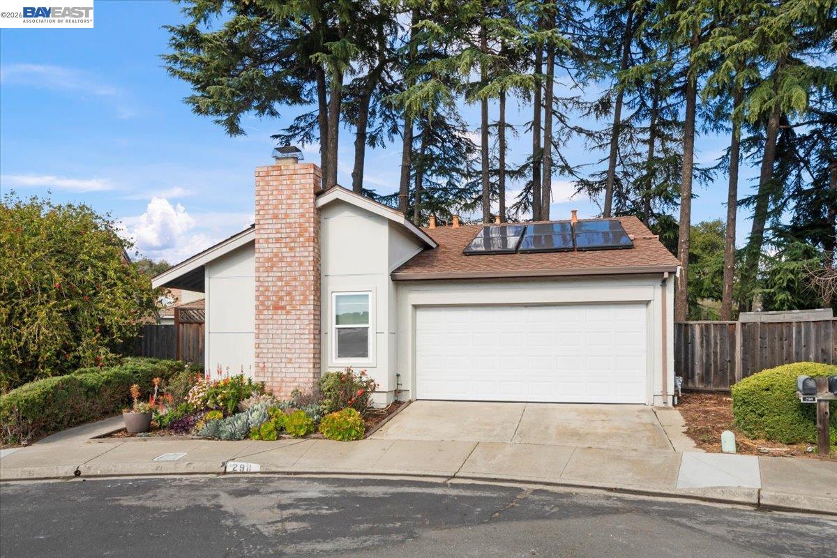 298 Edwin Way Hayward, CA 94544 - Photo 2 of 24 a front view of a house with a garden and a tree