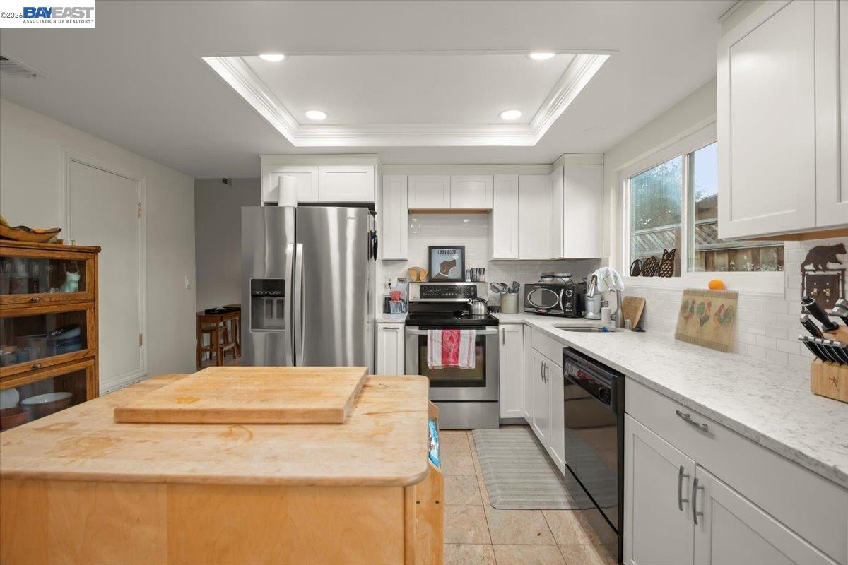 298 Edwin Way Hayward, CA 94544 - Photo 9 of 24 a kitchen with stainless steel appliances granite countertop a refrigerator sink and cabinets