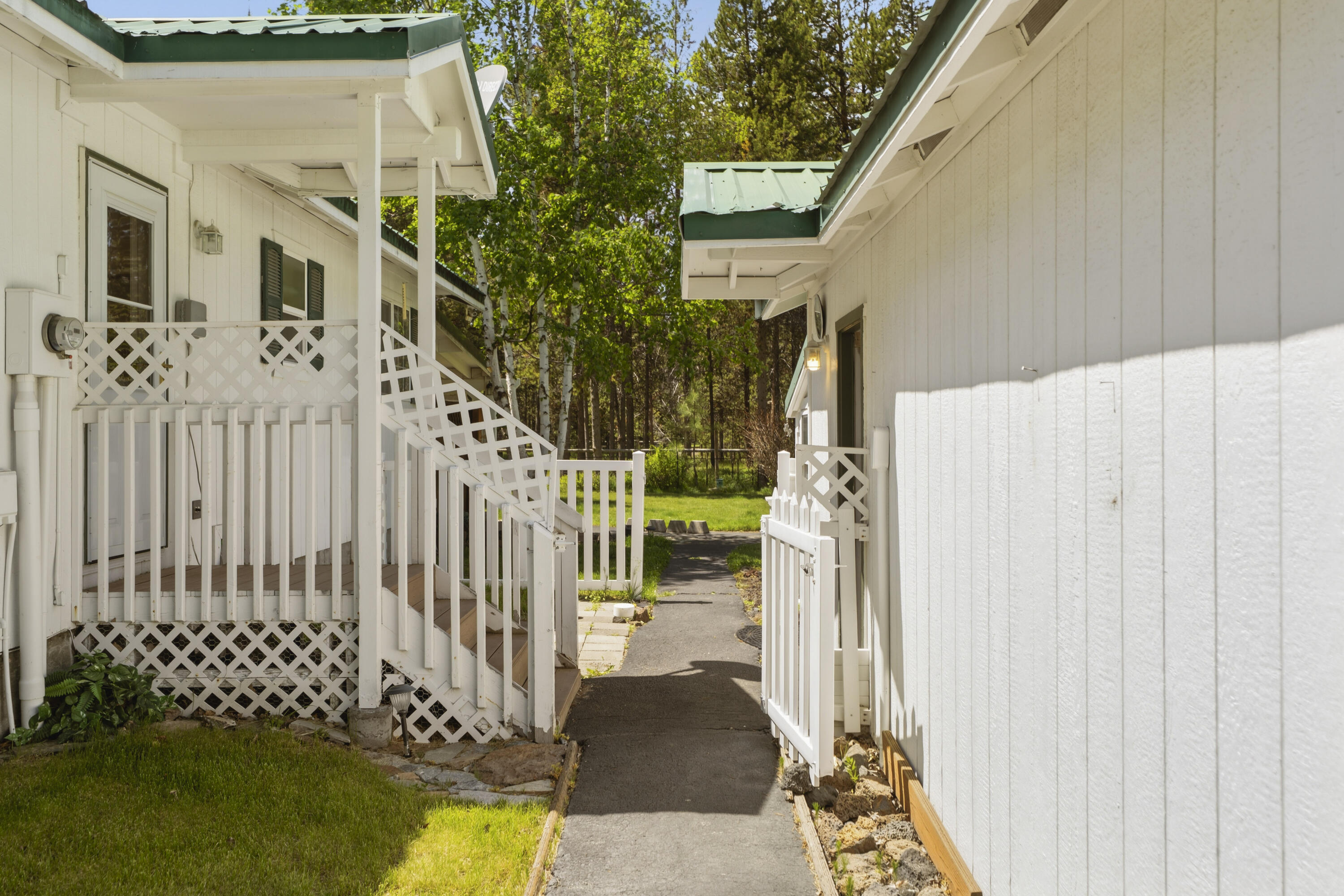 55885 Osprey Road Bend, OR 97707 - Photo 33 of 58 Pathway leading to mudroom entry, garage entry, and workroom/yard.
