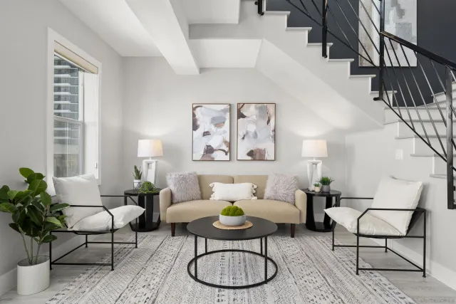 a living room with furniture and a chandelier
