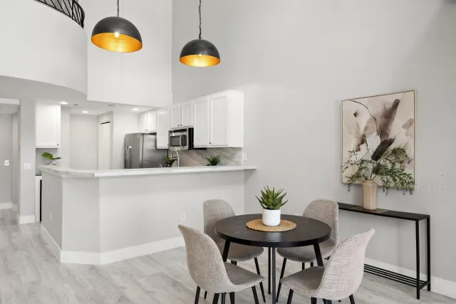 a kitchen with stainless steel appliances granite countertop a refrigerator sink and stove