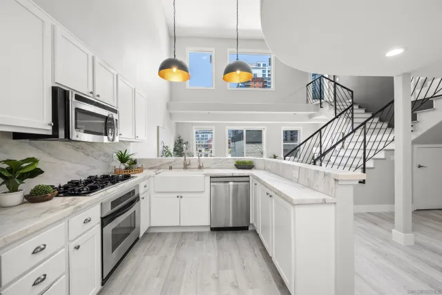 a kitchen with cabinets and window