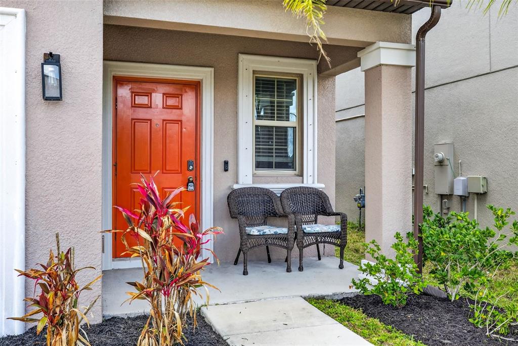9616 Lemon Drop Loop Sun City Center, FL 33573 - Photo 6 of 53 a backyard of a house with outdoor seating