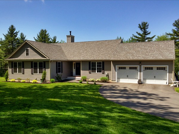 58 Snake Hill Road Ayer, MA 01432 - Photo 1 of 22 a front view of a house with a garden