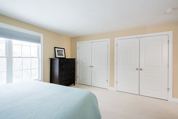 58 Snake Hill Road Ayer, MA 01432 - Photo 11 of 22 a bedroom with a bed and closet