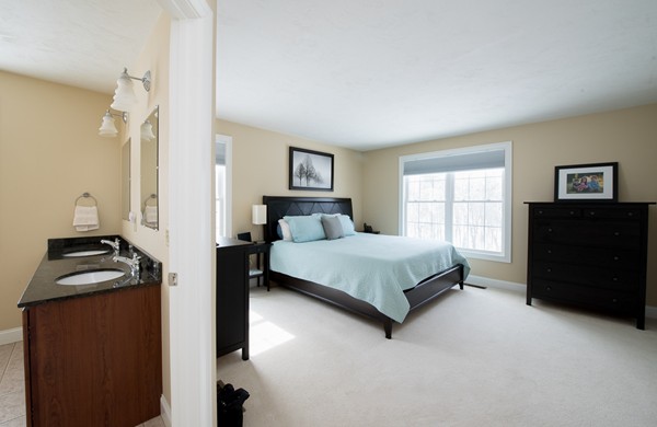 58 Snake Hill Road Ayer, MA 01432 - Photo 13 of 22 a bedroom with a bed and a dresser