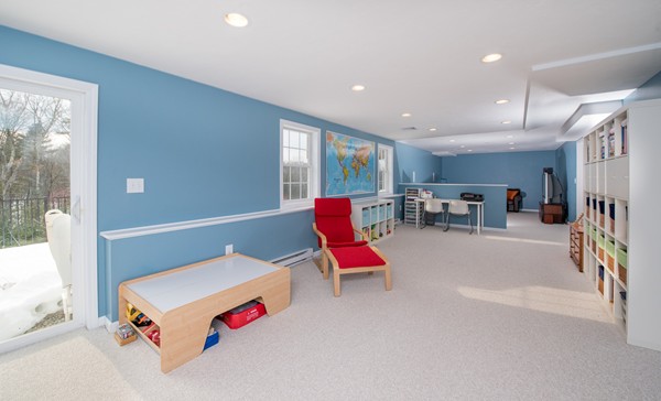 58 Snake Hill Road Ayer, MA 01432 - Photo 19 of 22 a living room with furniture and a floor to ceiling window