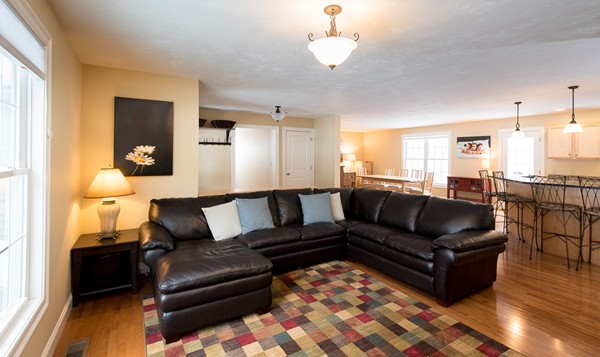 58 Snake Hill Road Ayer, MA 01432 - Photo 5 of 22 a living room with furniture wooden floor and a view of kitchen