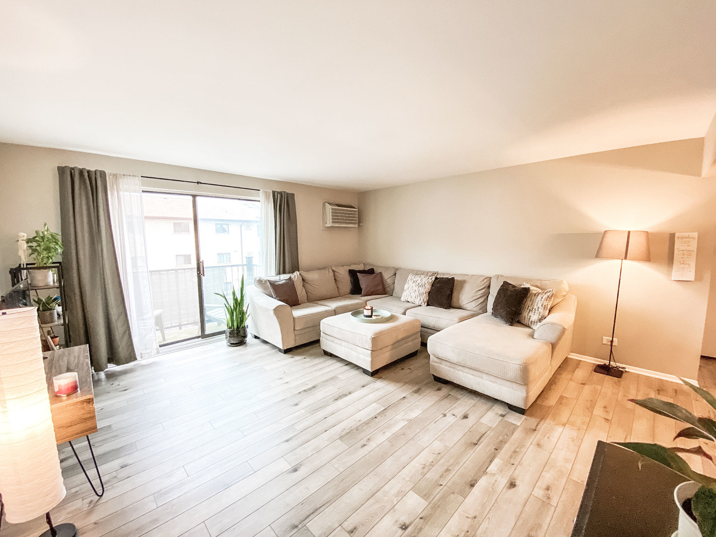 5113 North East River Road, Unit 3C Chicago, IL 60656 - Photo 3 of 11 a spacious bedroom with a bed a couch and large window