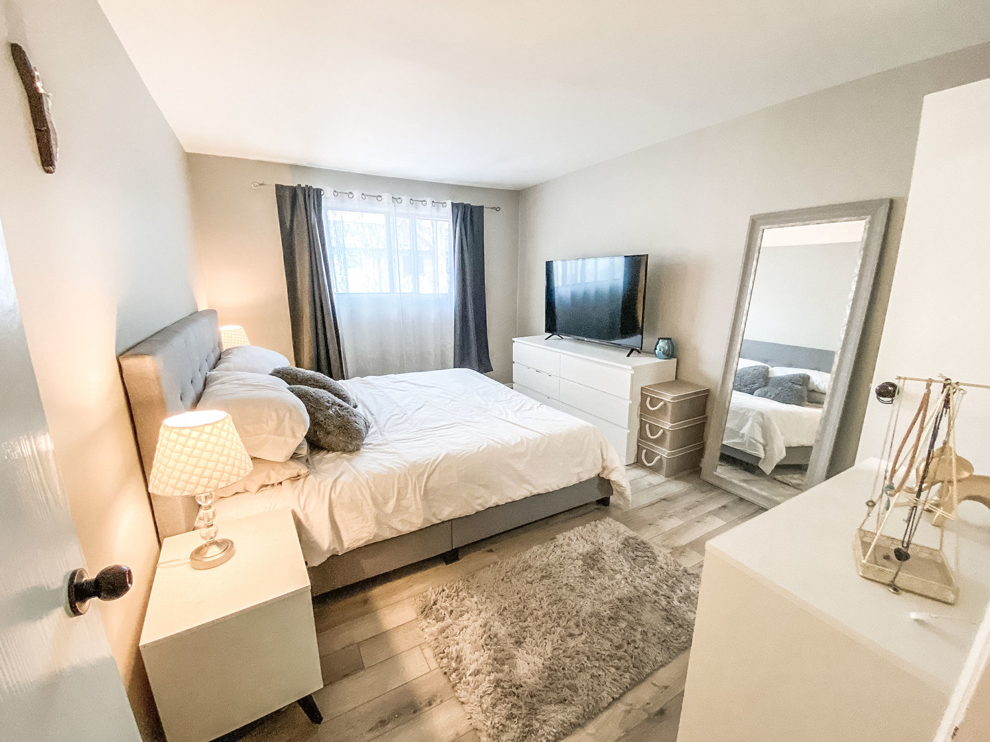 5113 North East River Road, Unit 3C Chicago, IL 60656 - Photo 8 of 11 a bedroom with a bed and flat screen tv