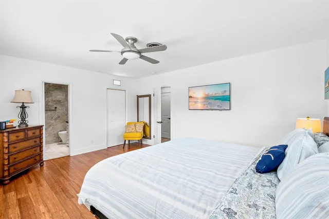 a bathroom with a granite countertop shower a sink and toilet
