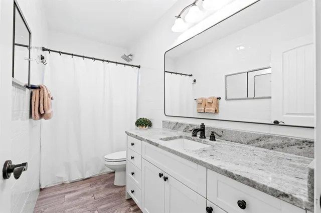 a bed room with a bed and a window