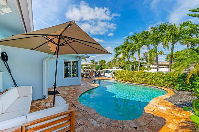 a view of swimming pool with a yard