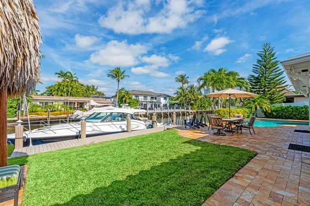 a view of a swimming pool with a table and chairs