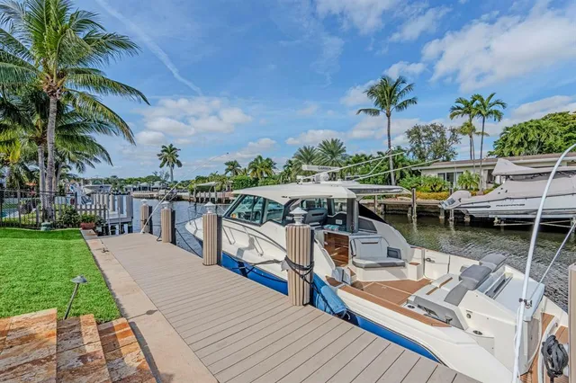 a view of a lake with a house in the background