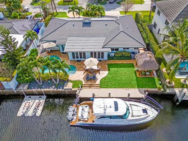 an aerial view of a house with a lake view