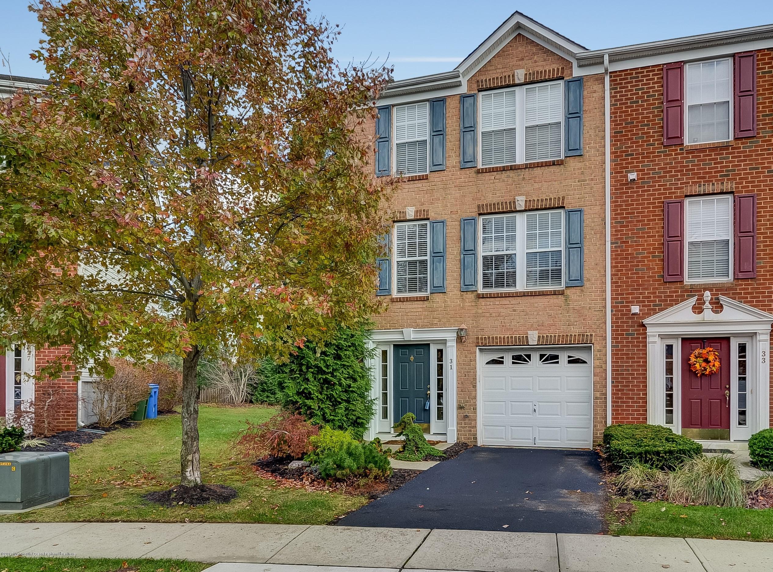31 Saxton Road, Unit 53 Farmingdale, NJ 07727 - Photo 1 of 25 a front view of a house with garden