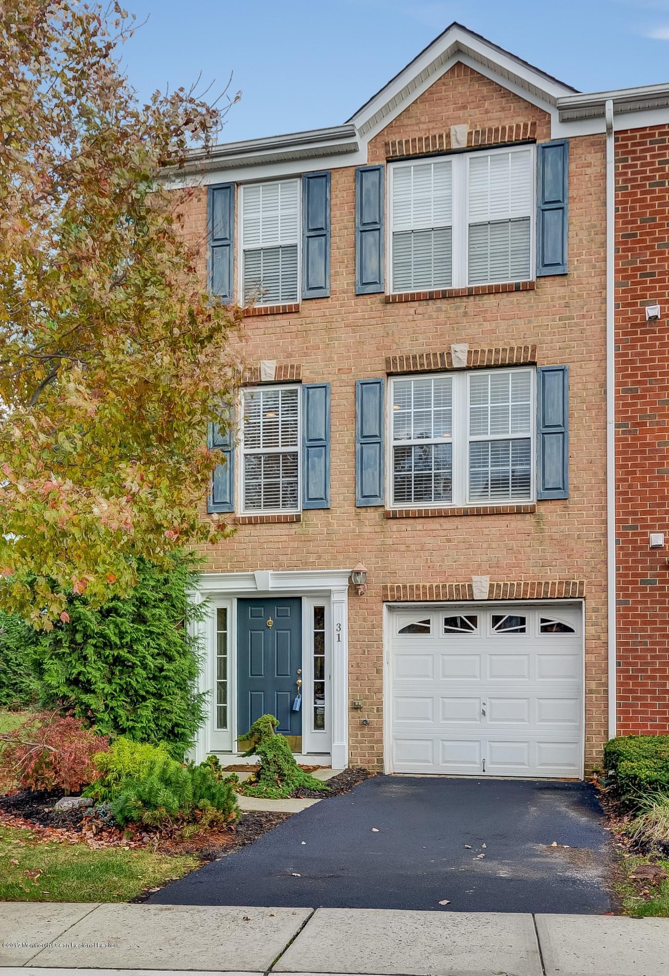 31 Saxton Road, Unit 53 Farmingdale, NJ 07727 - Photo 2 of 25 front view of a brick house
