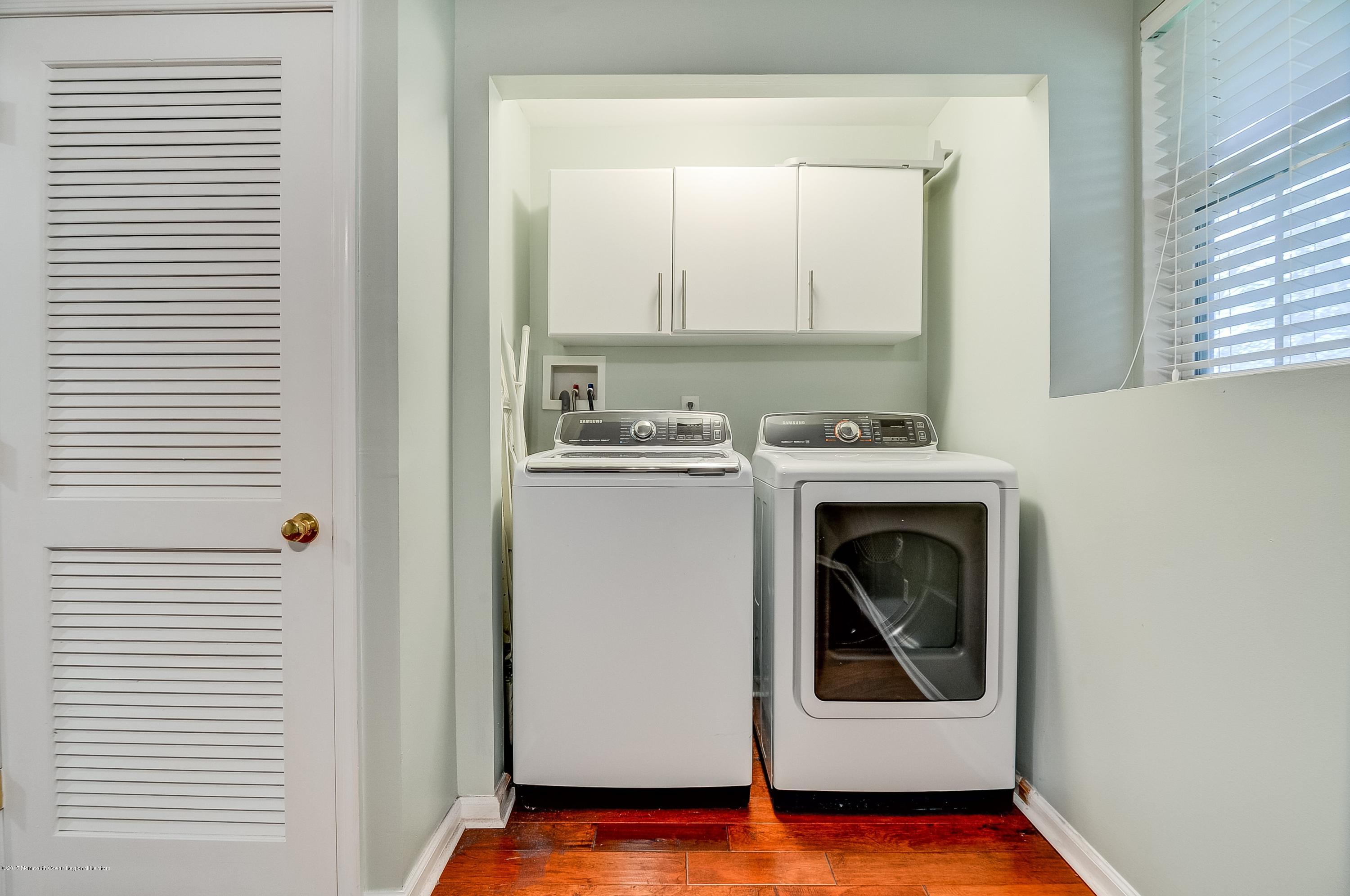 31 Saxton Road, Unit 53 Farmingdale, NJ 07727 - Photo 22 of 25 a utility room with dryer and washer