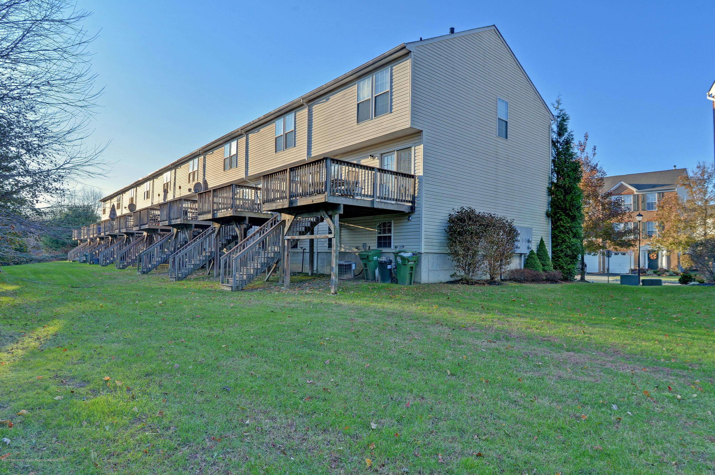 31 Saxton Road, Unit 53 Farmingdale, NJ 07727 - Photo 23 of 25 a view of a house with a yard