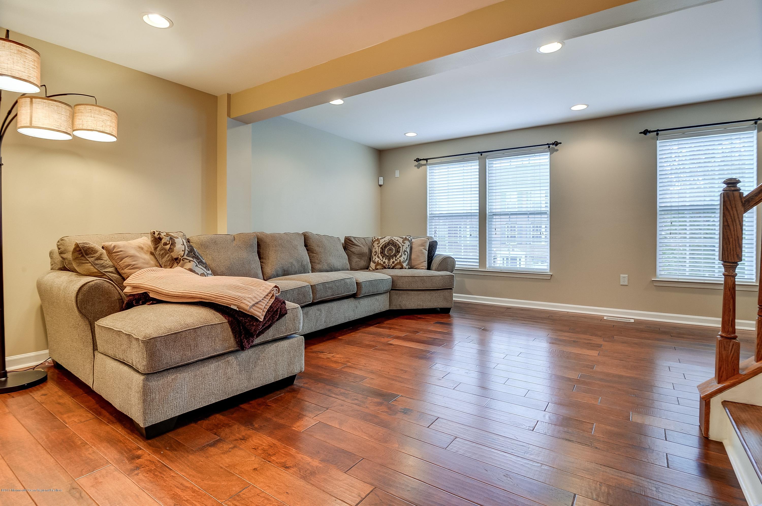 31 Saxton Road, Unit 53 Farmingdale, NJ 07727 - Photo 5 of 25 a living room with furniture and a large window