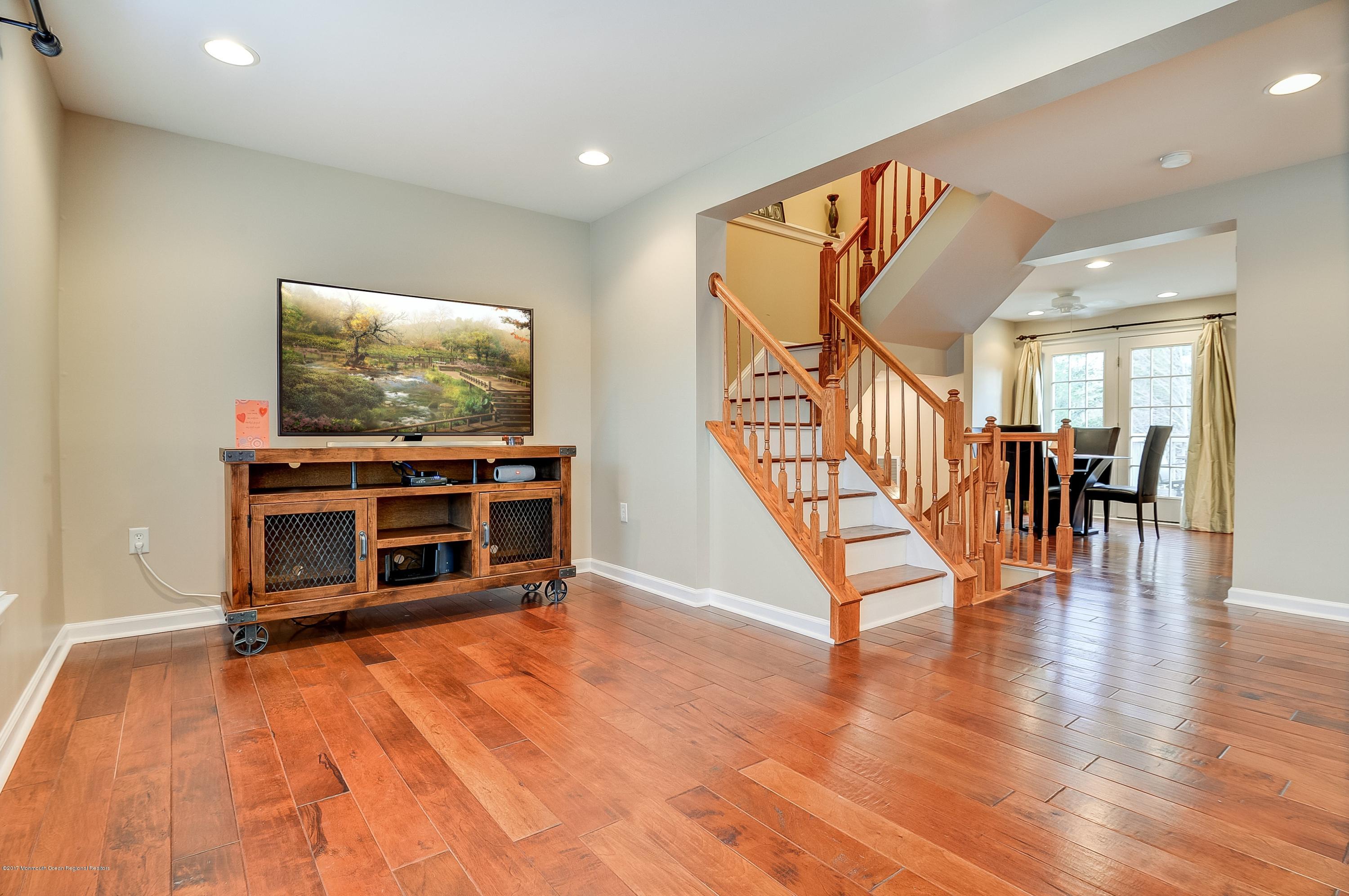 31 Saxton Road, Unit 53 Farmingdale, NJ 07727 - Photo 7 of 25 a living room with furniture and a flat screen tv