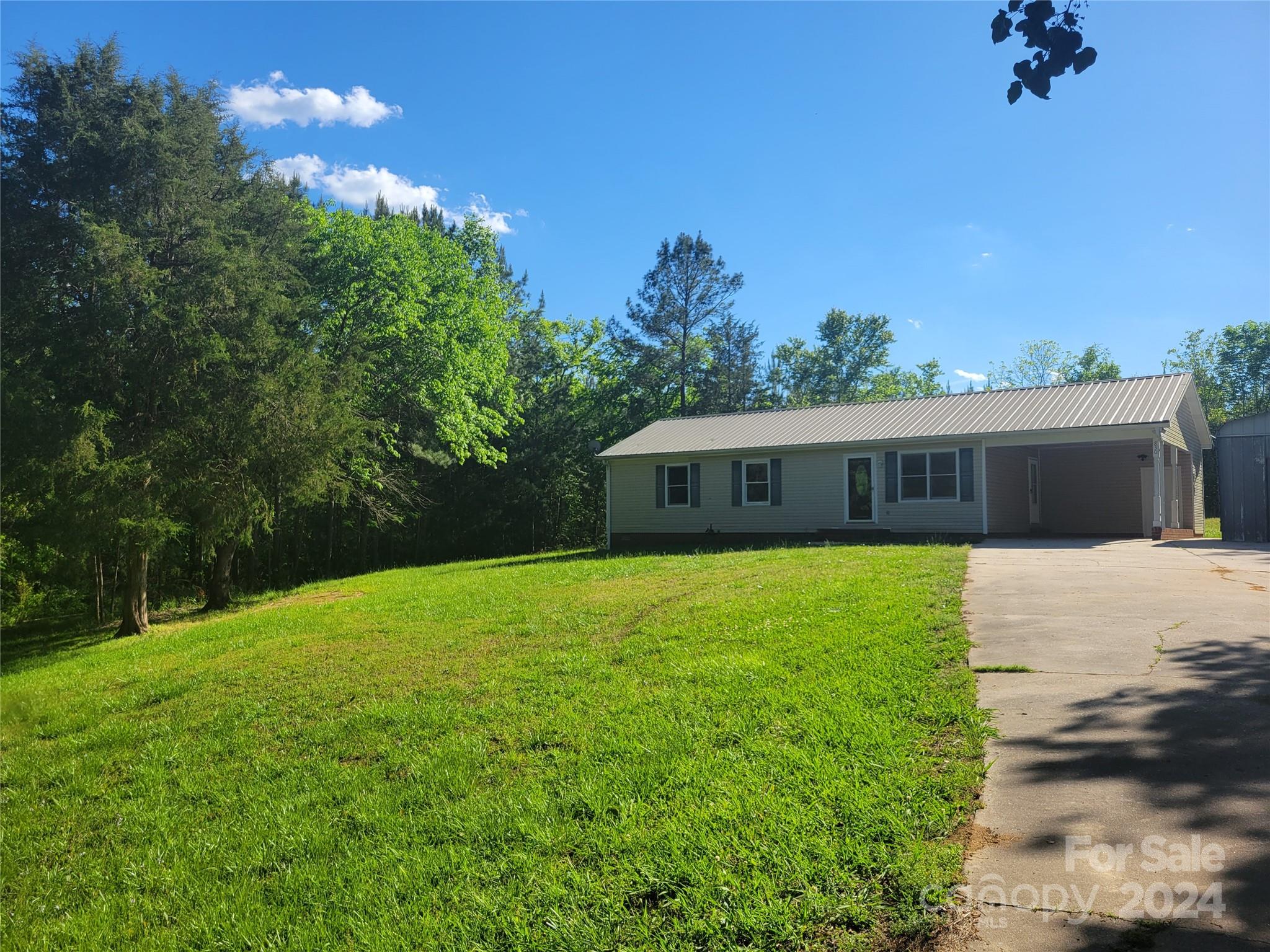 830 Long Branch Road Grover, NC 28073 - Photo 1 of 37 a front view of a house with a yard