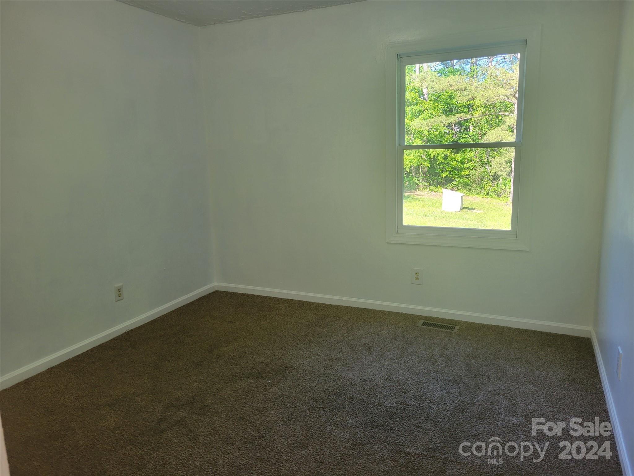 830 Long Branch Road Grover, NC 28073 - Photo 14 of 37 an empty room with a window