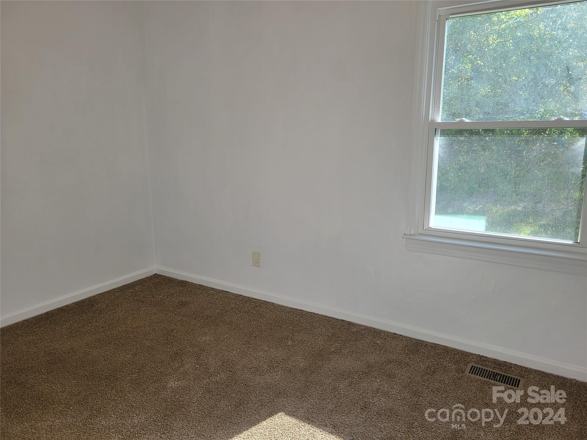 830 Long Branch Road Grover, NC 28073 - Photo 17 of 37 an empty room with a window