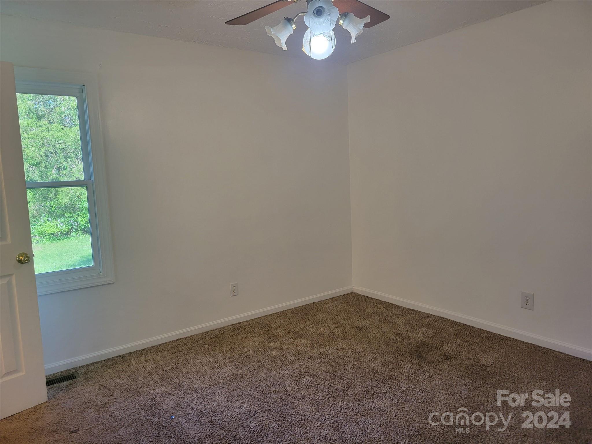 830 Long Branch Road Grover, NC 28073 - Photo 19 of 37 an empty room with a window