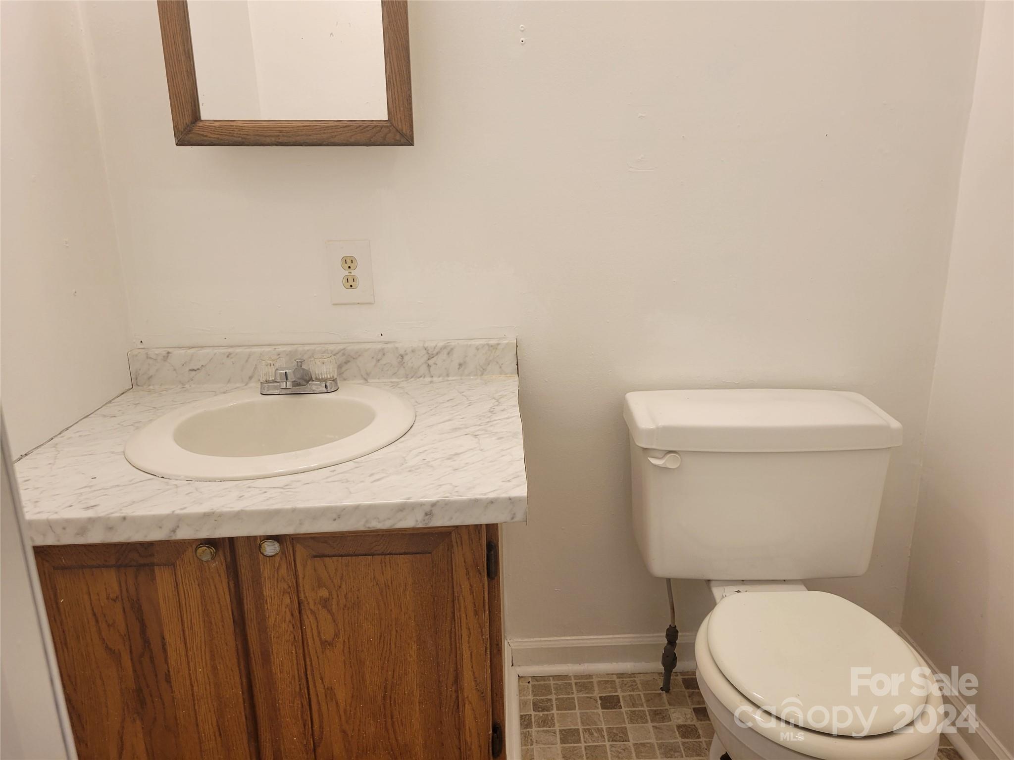 830 Long Branch Road Grover, NC 28073 - Photo 22 of 37 a white toilet sitting next to a bathroom sink