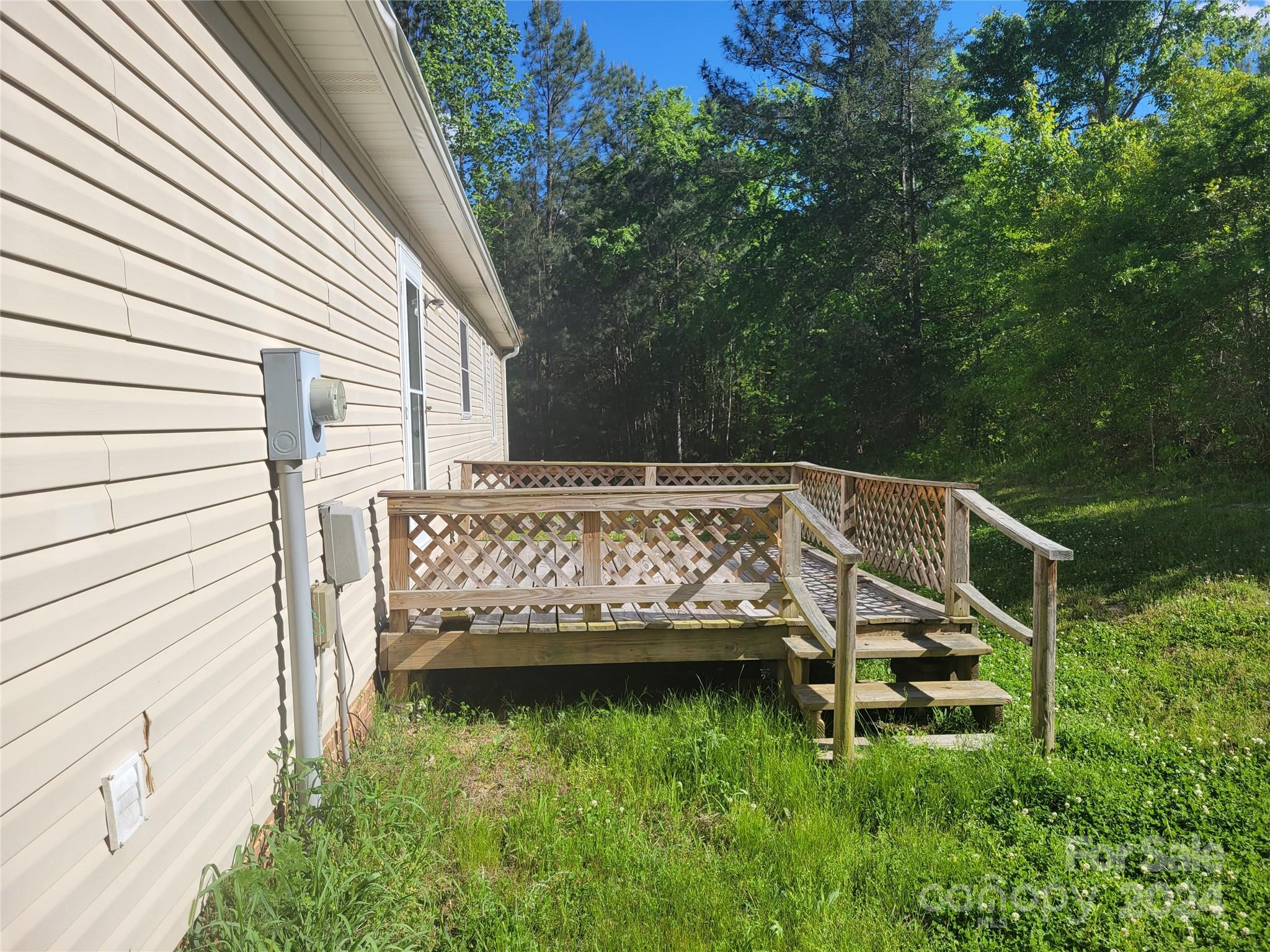 830 Long Branch Road Grover, NC 28073 - Photo 23 of 37 a view of a backyard with sitting area