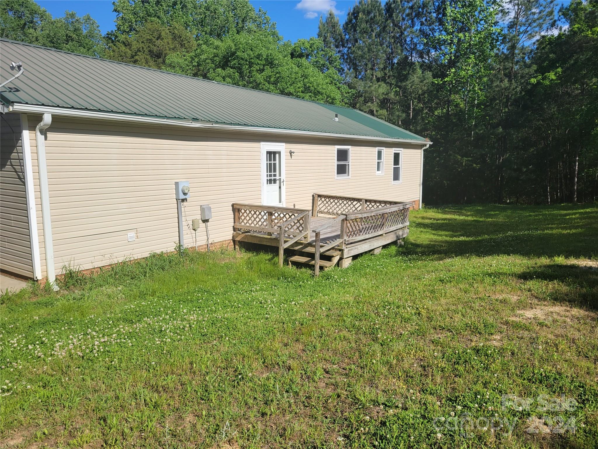 830 Long Branch Road Grover, NC 28073 - Photo 24 of 37 a view of a house with a yard and sitting area