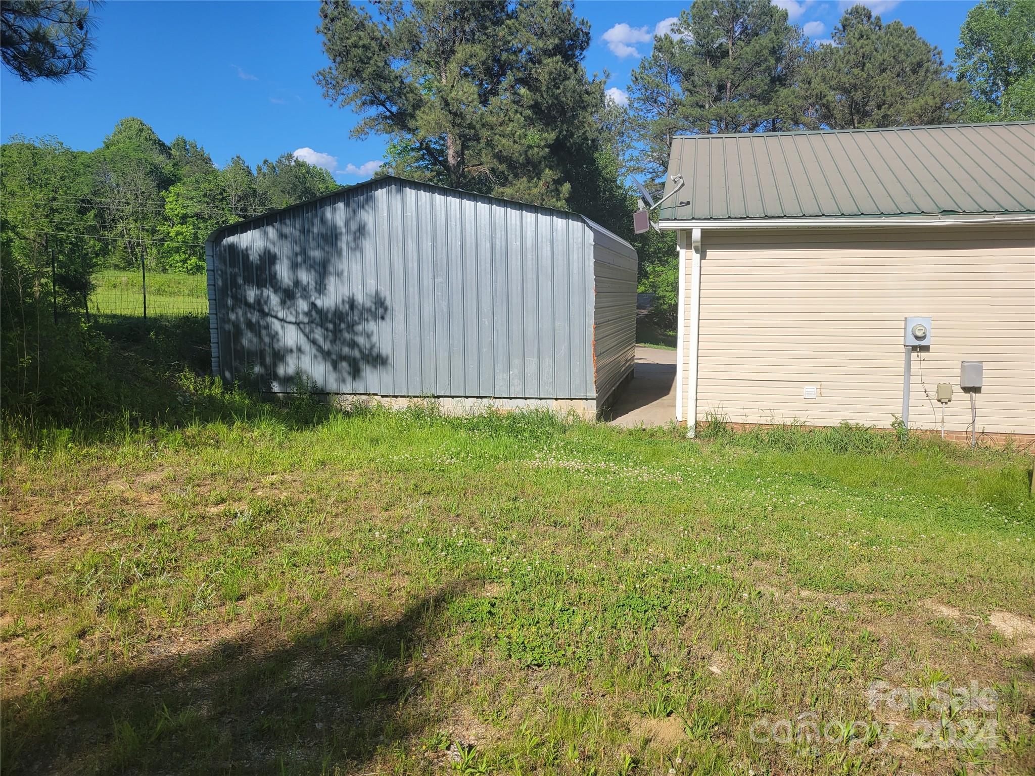 830 Long Branch Road Grover, NC 28073 - Photo 25 of 37 a backyard of a house with lots of green space