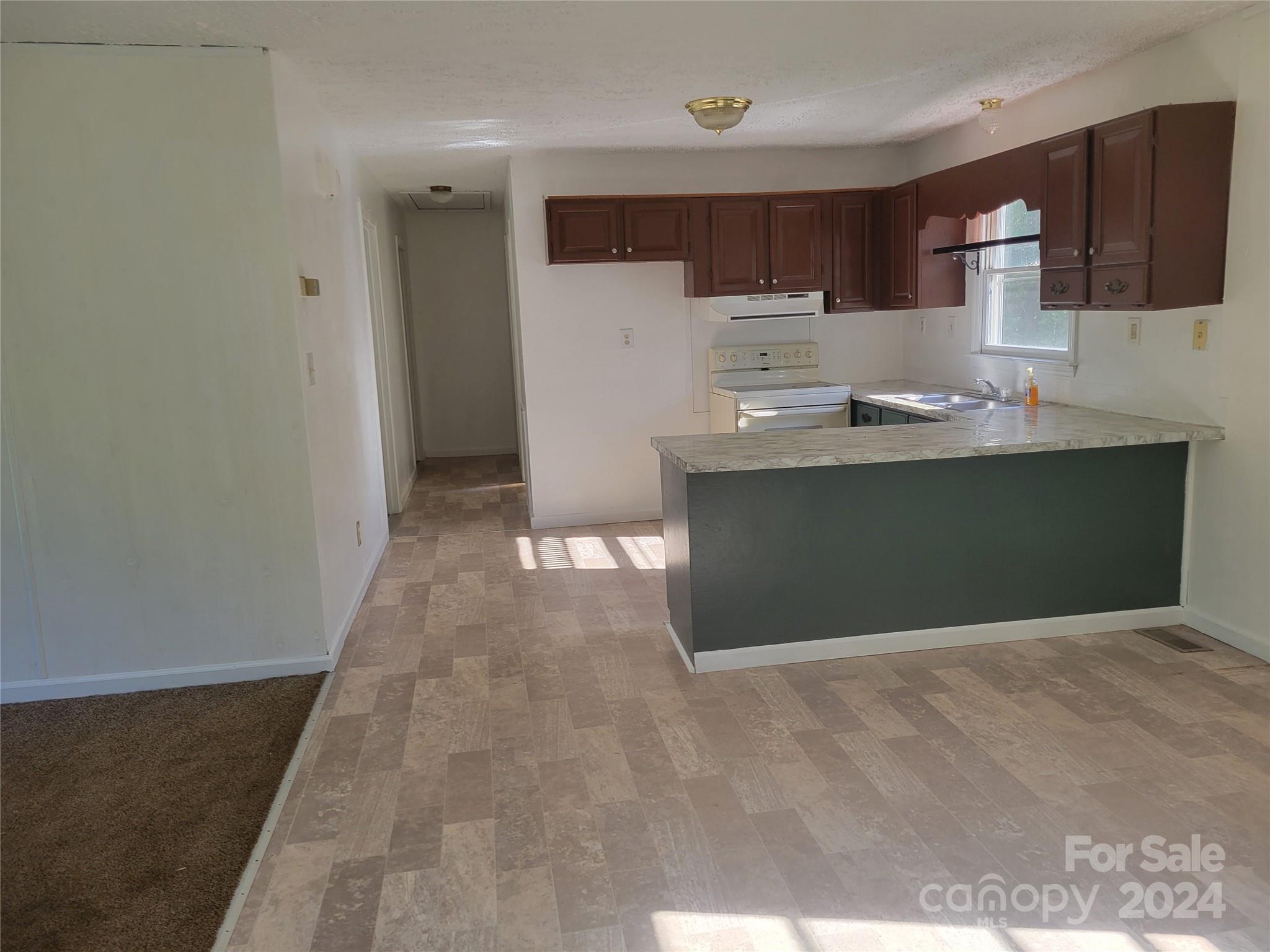 830 Long Branch Road Grover, NC 28073 - Photo 9 of 37 a view of kitchen with stainless steel appliances granite countertop a refrigerator and a sink