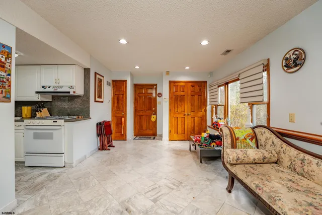 a spacious bedroom with a bed and a walk in closet