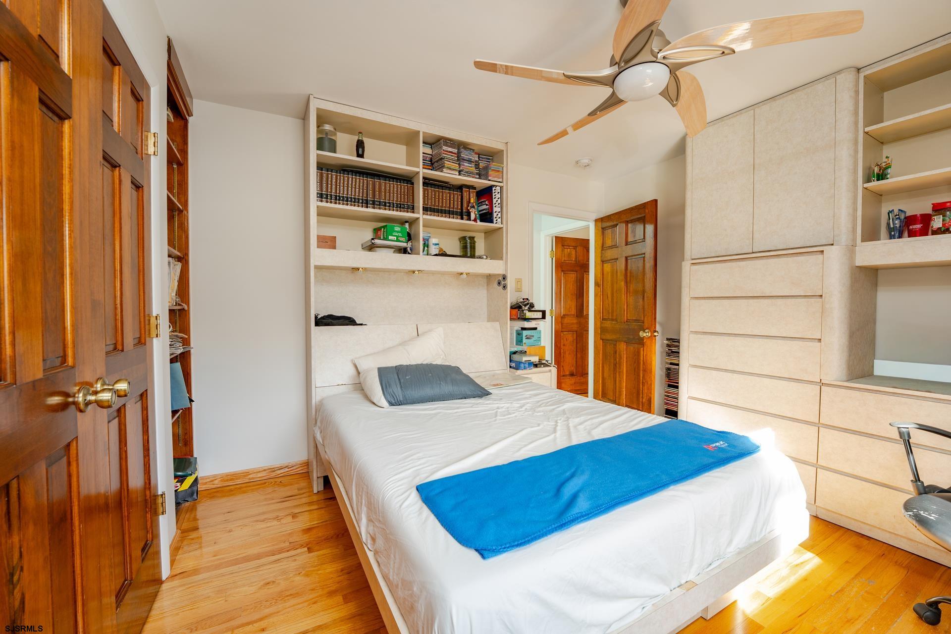 953 Chestnut Avenue Sewell, NJ 08080 - Photo 21 of 76 a bedroom with a bed and a table with the outer view