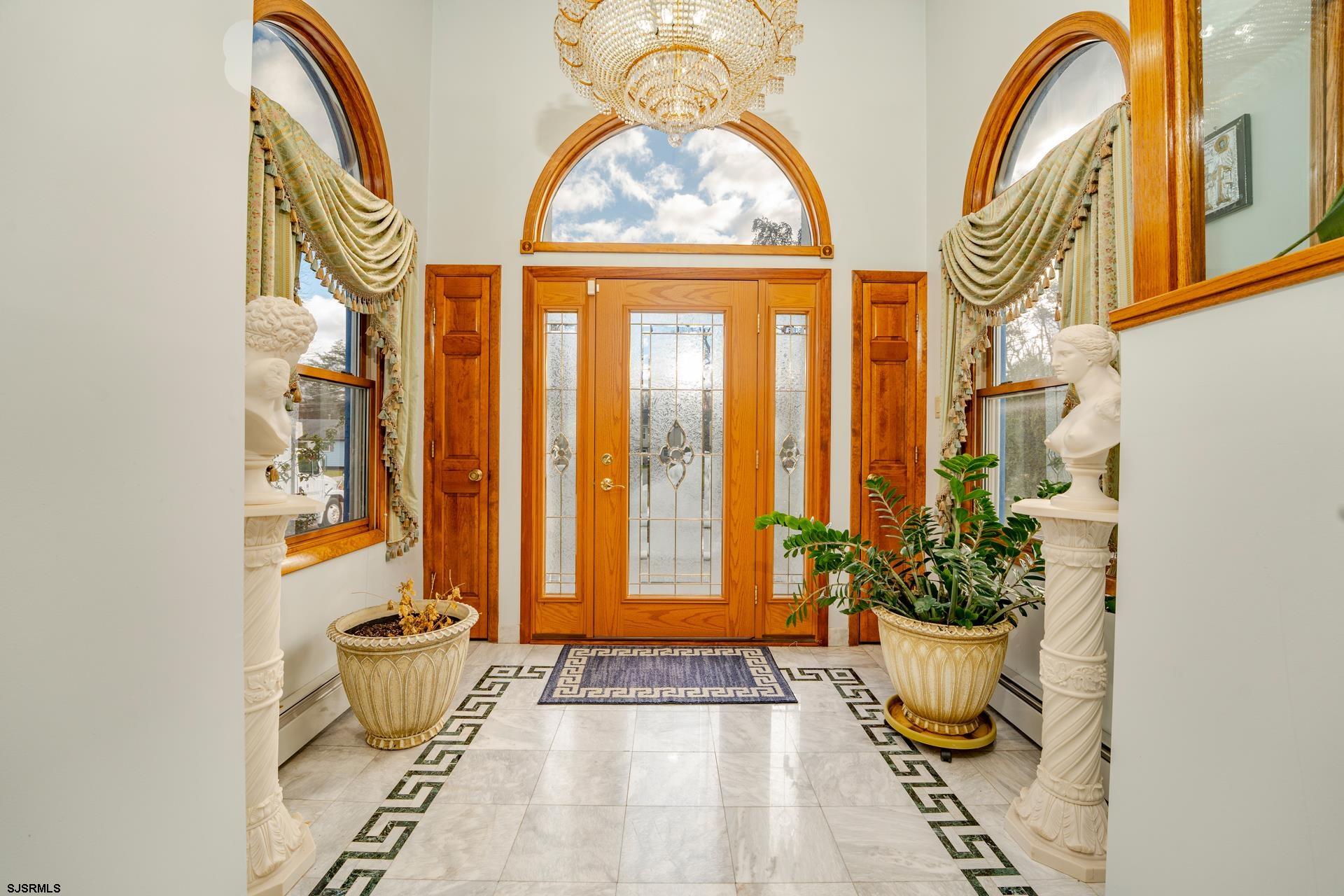 953 Chestnut Avenue Sewell, NJ 08080 - Photo 26 of 76 a view of an entryway with a flower pot and a window