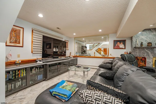 a view of a swimming pool with a patio and a yard